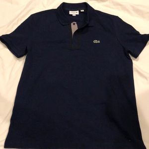 Blue Lacoste shirt with black outline